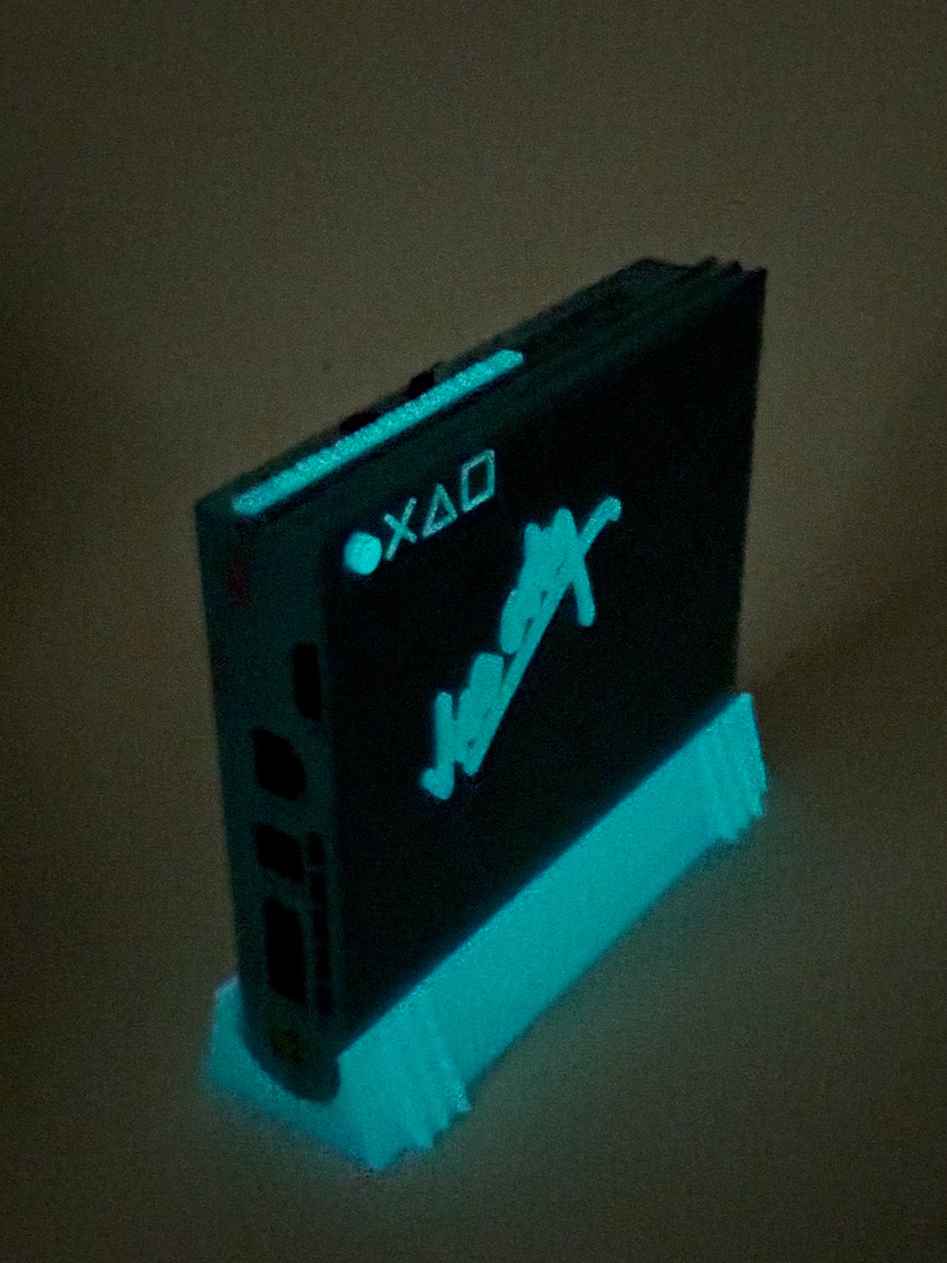 Glowing blue electronic device with 'Sony' logo on a dark background